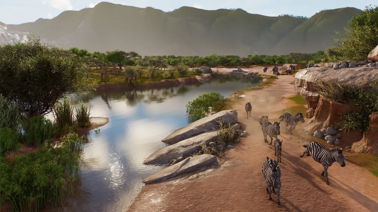Planet Zoo 2 – slonice se slůnětem ve výběhu s jezírkem a stromy